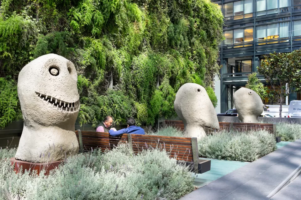 A privately owned public space at 555 Mission Street with large sculptures and benches.